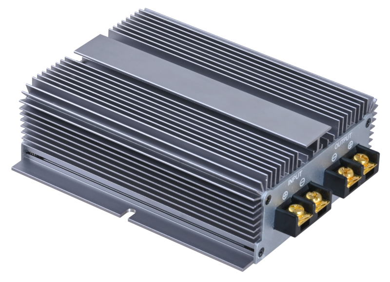 A silver aluminum heatsink electronic module with a ribbed metal casing, featuring two black terminal blocks with gold screw terminals on one end, shown on a plain white background.